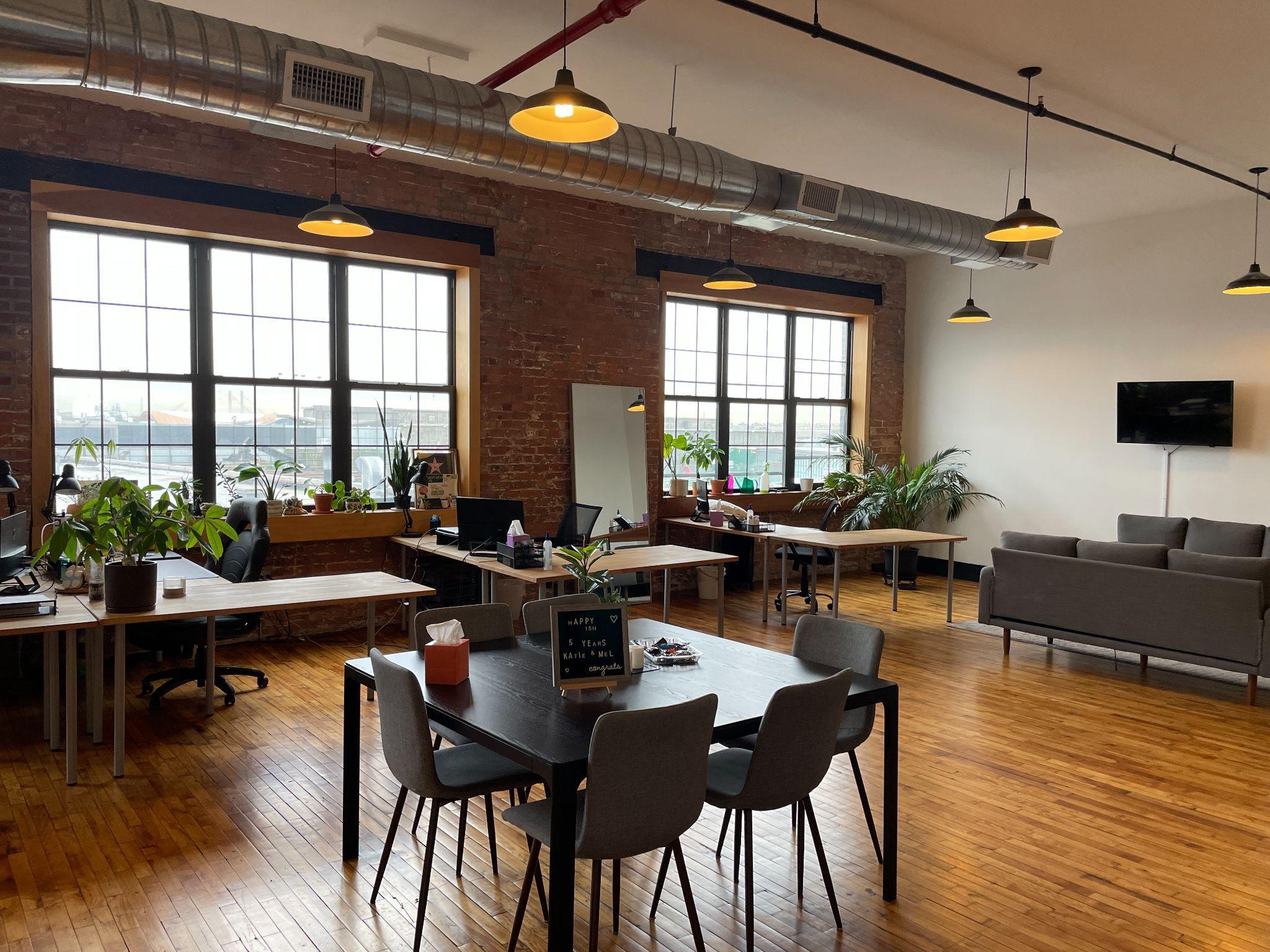 Bright creative office with exposed ductwork